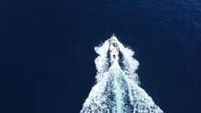 Boat Driving Through The Water Drone Shot