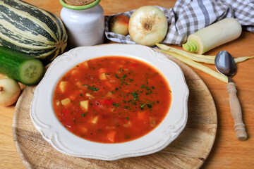 Poster - Red vegetable soup on a plate.