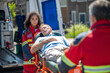 © zinkevych - Paramedical staff transporting an unconscious patient to the ambulance car