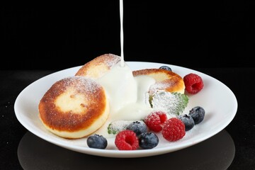 Wall Mural - Cottage cheese fritters with yogurt or cream