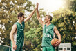 © C Coetzee/peopleimages.com - Sports, basketball and high five at a basketball court with men hands connected in support of fitness mission. Team, energy and motivation by professional athlete deal for goal and success in game