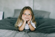 © F8  \ Suport Ukraine - Portrait of cute girl lying in the bed