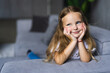 © F8  \ Suport Ukraine - Portrait of smile little girl laying on couch