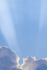 Wall Mural - Background from blue sky with sun rays across clouds