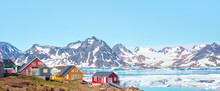 Panoramic View Of Colorful Kulusuk Village In East Greenland - Kulusuk, Greenland - Melting Of A Iceberg And Pouring Water Into The Sea