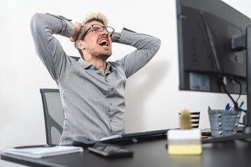 Businessman stressed out and screaming at the office. Stress at work concept