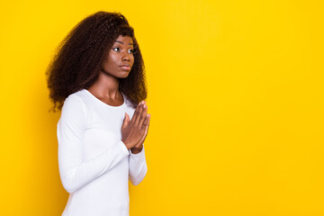 Poster - Profile photo of calm peaceful lady arms palms touch pray plead look empty space isolated on yellow color background