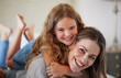 © Alexis Scholtz/peopleimages.com - Relax, hug and portrait of mother with child in New Zealand family home enjoy bonding together. Care, love and happy mother smiling with young daughter in house on weekend for leisure time.