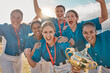 © L Ismail/peopleimages.com - Women baseball team portrait, winning trophy celebration and sports success, champion and competition achievement. Happy girls softball players, winners group and excited athletes holding award prize