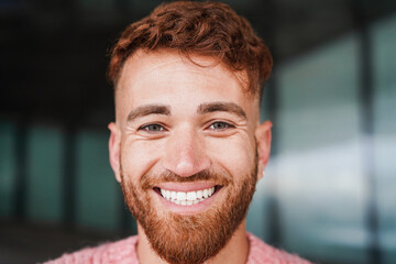 Wall Mural - Young red hair man smiling on camera outdoor