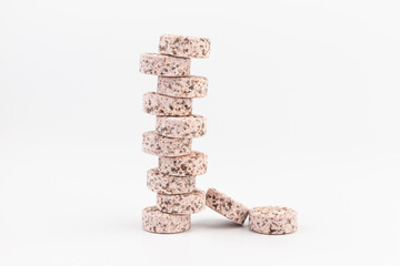 Wall Mural - Heap of medicine colored pills, tablets on a white background