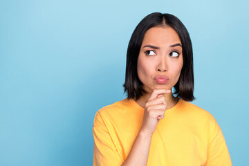 Sticker - Portrait photo of young pretty adorable cute nice woman pouted lips look distrust empty space isolated on blue color background