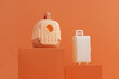 Concept travel or moving with animal, flight, safety. Plastic cage, pet carrier and suitcase on orange background