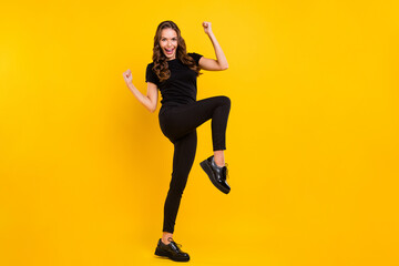 Poster - Full body profile side photo of young cheerful girl rejoice victory fists hands triumph success isolated over yellow color background