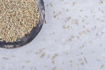 Wall Mural - Dried green anise seeds on a platter