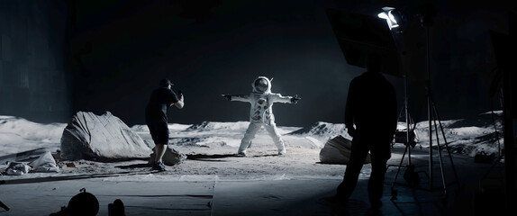 Wall Mural - wide behind the scenes, cinematographer shooting viral video for social account on a large moon land