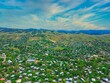 Aerial of houses and nature with the background of mountains in East Honiara, Solomon Islands