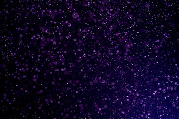 Wall Mural - dust blue particles on black background. glittering sparkling bokeh overlay with copy space for text