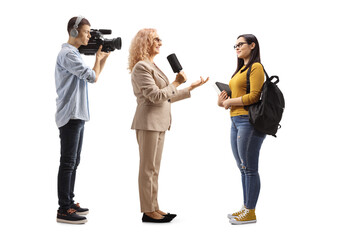 Wall Mural - Female reporter interviewing a student and camera man recoridng