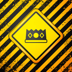 Wall Mural - Black King crown icon isolated on yellow background. Warning sign. Vector