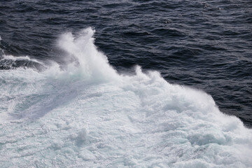 Wall Mural - Waves in the ocean from a ship 
