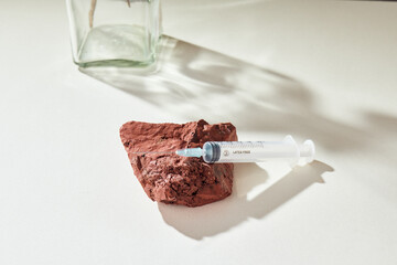 Medicine concept mockup with syringe on a delicate natural beige background and props. Health care, doctor, medic. Check my profile for more!