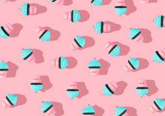 Wall Mural - Colorful pattern of ice cream on a pastel pink background. Creative minimum summer flat laying.