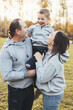© Strelciuc - Happy family posing together in autumn garden, park. Family concept. Happy family outdoors. Happy family, childhood. Outdoor lifestyle. Youth lifestyle. People