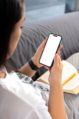 holding smartphone, over shoulder view of woman holding smartphone. modern vertical cell phone mock 
