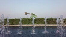 Fountain near the Force Of Nature statue by Lorenzo Quinn at Katara Cultural Village, Doha Qatar. Beautiful sculpture, concept for motion, movement, equilibrium, slow motion