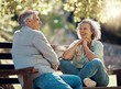 © C Coetzee/peopleimages.com - Park bench, couple and senior people with love and happiness in nature enjoying summer. Happy smile of elderly woman and man retirement together relax laughing outdoor having a fun conversation
