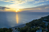 Fototapeta Na ścianę - The sun rises over Gdansk Bay in Gdynia from the side of the city boulevard, aerial photo
