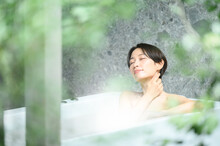 Woman Relaxing In The Bath Tub