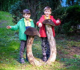 Wall Mural - Two preschool children exploring forest, in autumn clothing, pla