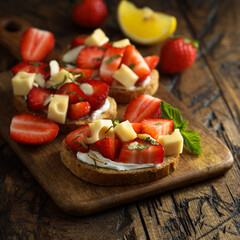 Canvas Print - Strawberry toasts with almon and cheese