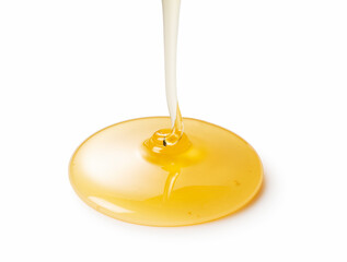 Wall Mural - Moment of dripping honey on white background.