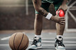 © Clement Coetzee/peopleimages.com - Sports, injury in basketball and knee pain or athlete man while on an outdoors court holding his hurt leg during training or exercise for hobby. Closeup of male hands on glowing red body part