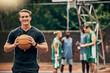 © C Coetzee/peopleimages.com - Outdoor basketball court, coach and happy man portrait training, collaboration and sports for college athlete team, professional player and fitness group. Proud, smile and teaching expert game skills