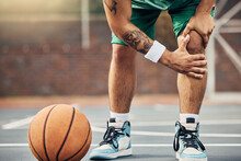 Basketball, Athlete And Knee Injury On The Basketball Court During Outdoor Game Or Training. Man In With Leg Pain After Sports Accident With A Broken Joint, Inflammation Or Muscle Tear During Match.
