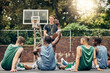 © C Coetzee/peopleimages.com - Basketball coaching, training meeting and team with question for coach during sports on outdoor court. Professional athlete sport group talking about university sport game on campus in Canada