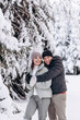 © Tatyana - Young couple in love hugging in the winter forest and having fun spending time together.Winter,Valentine's day,newlyweds, tenderness and love.