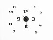 © Nadezda Ledyaeva - Minimalistic wall clock design with black numbers