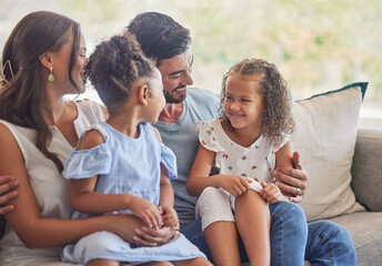 Happy, relax and love with family in sofa in living room together for lifestyle, care and support. Smile, youth and development with parents and children sitting on couch for happiness at home