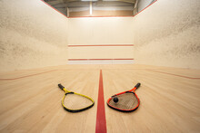 Empty Squash Court Ultra-wide Angle View. Racket And Ball On The Ground, No People