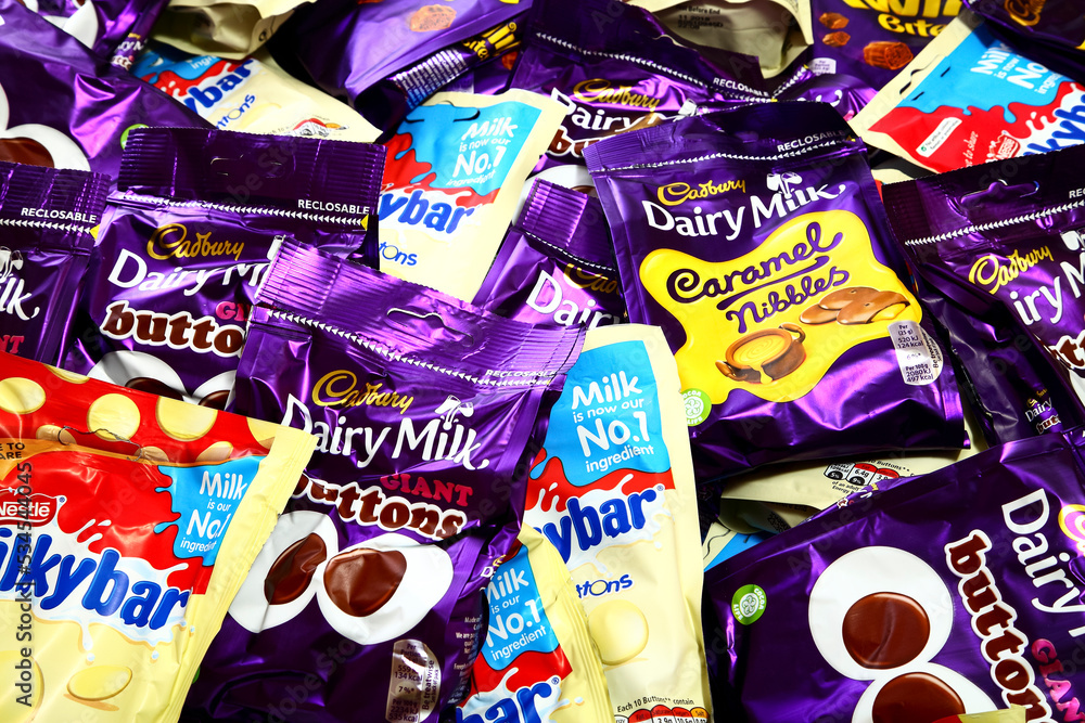 Packets of various chocholate snacks including cadbury twirl bites ...