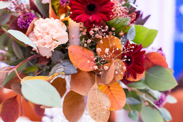 Wall Mural - Festive table setting with basket of autumn flowers, candle