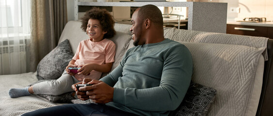 Wall Mural - Father look at son during they play video game