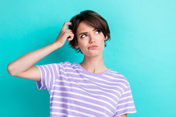 Sticker - Photo of gorgeous pretty funky positive girl dressed striped t-shirt look empty space arm on head isolated on teal color background