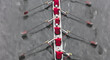 © Mint Images - Overhead view of a crew rowing in an octuple racing shell boat, rowers, motion blur.