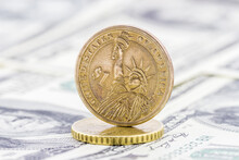 Close-up View Of One Dollar Coin On Banknotes Background